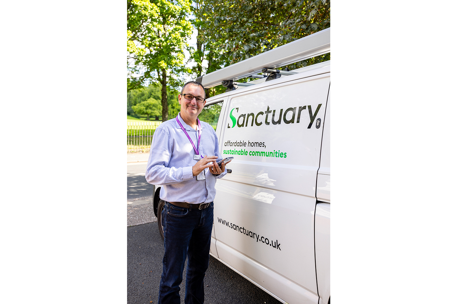 Supported living staff member outside housing association property photographed by Midlands public sector photographer
