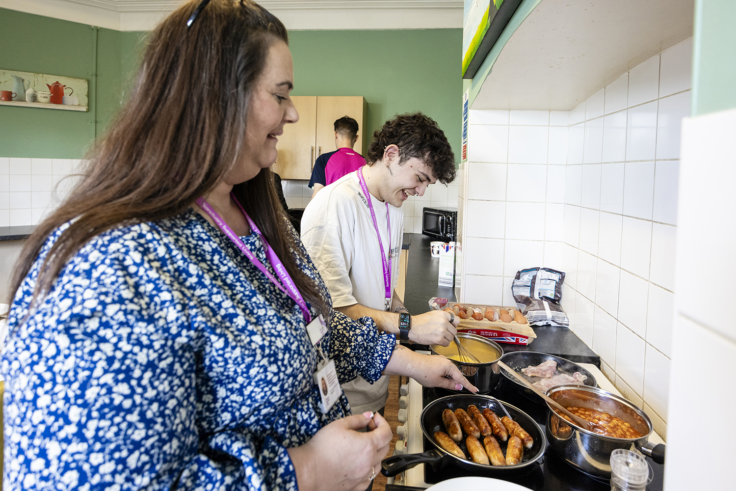Supported living staff and tenant preparing meal together in housing association property photographed by Midlands photographer