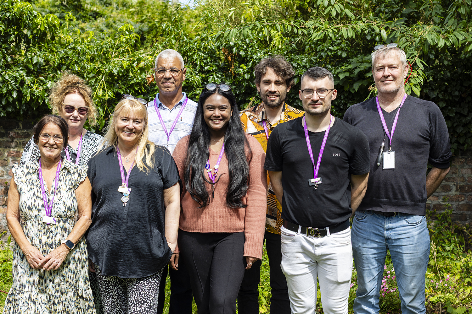 Supported housing team group photo at community property photographed by Midlands public sector photographer