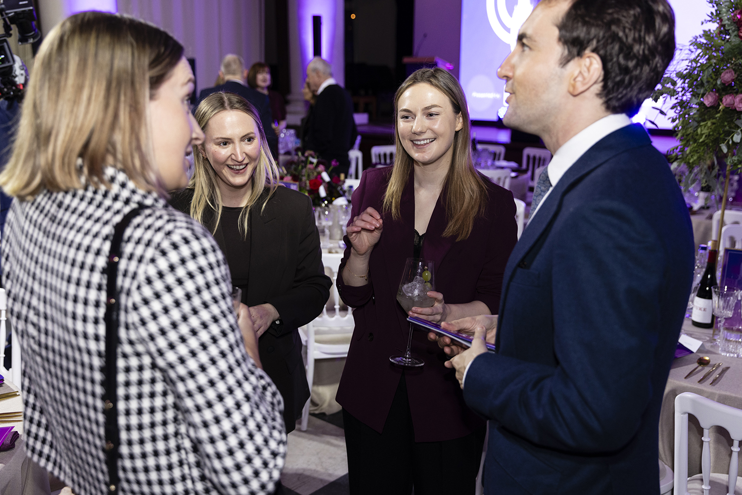 Attendees socialising with drinks at Political Podcast Awards London