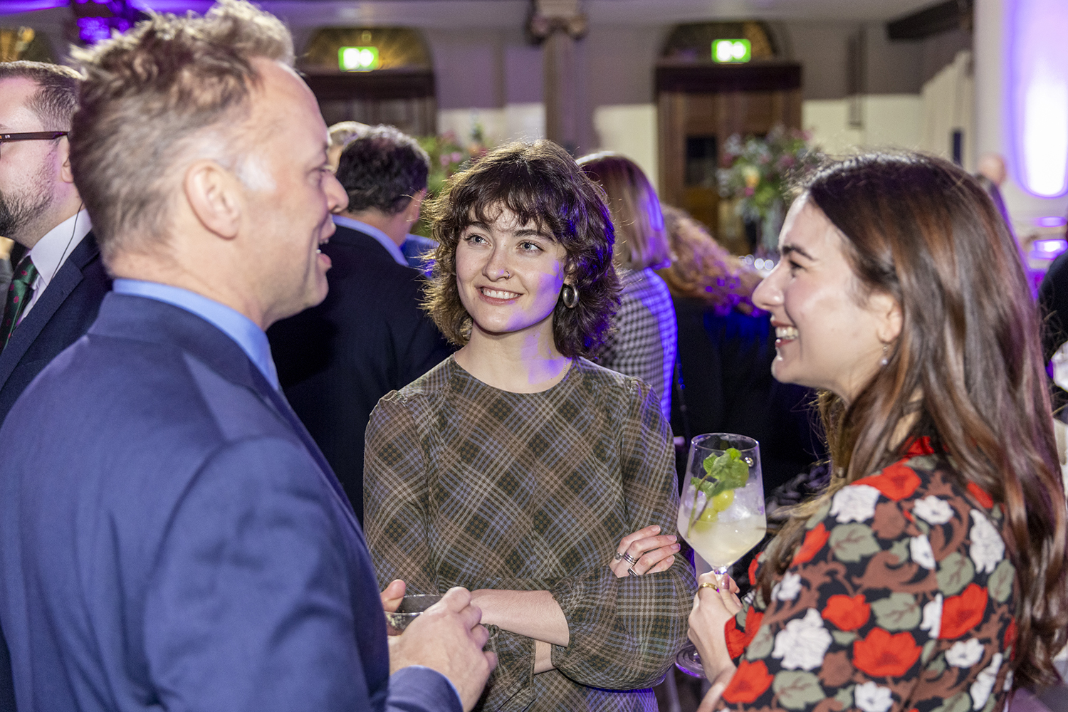 Attendees socialising with drinks at Political Podcast Awards London