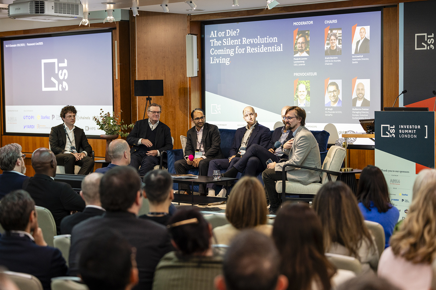 Wide view of conference audience during keynote presentation in central London venue